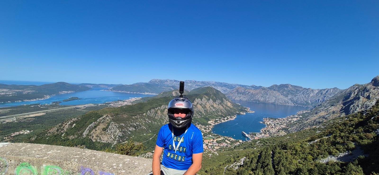Motorcycle rider overlooking the Bay of Kotor